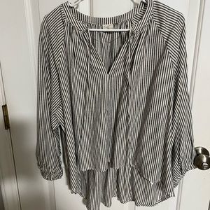 Black white striped shirt, cropped in front, longer in back.